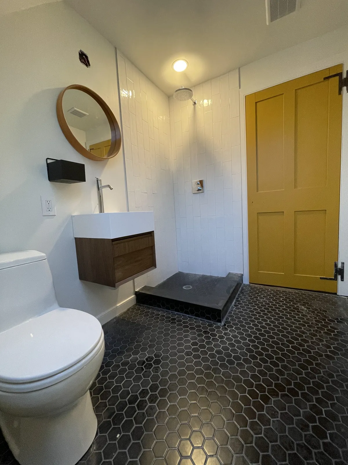 Wall-mounted vanity and round mirror