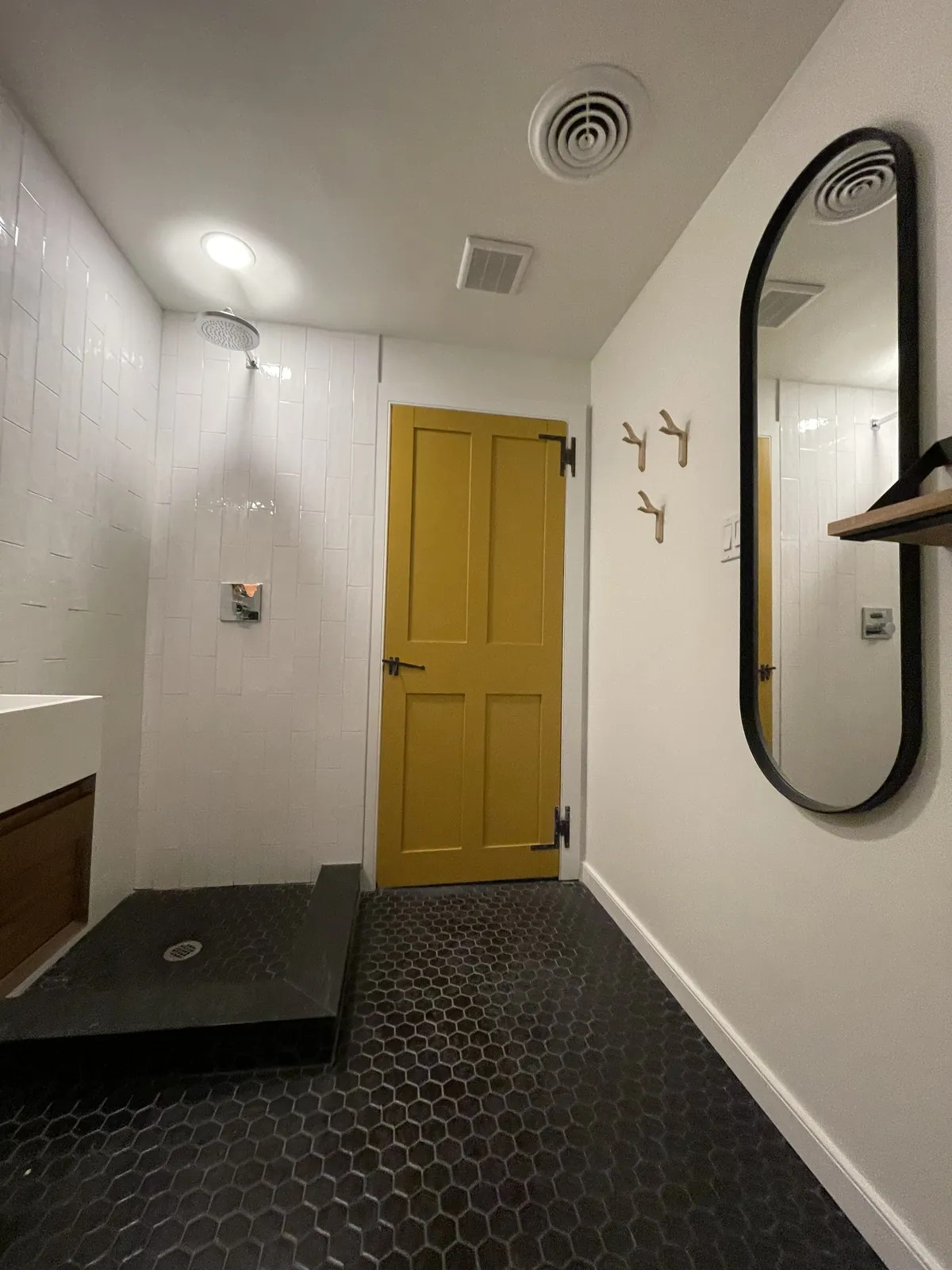Painted panel door and oval mirror