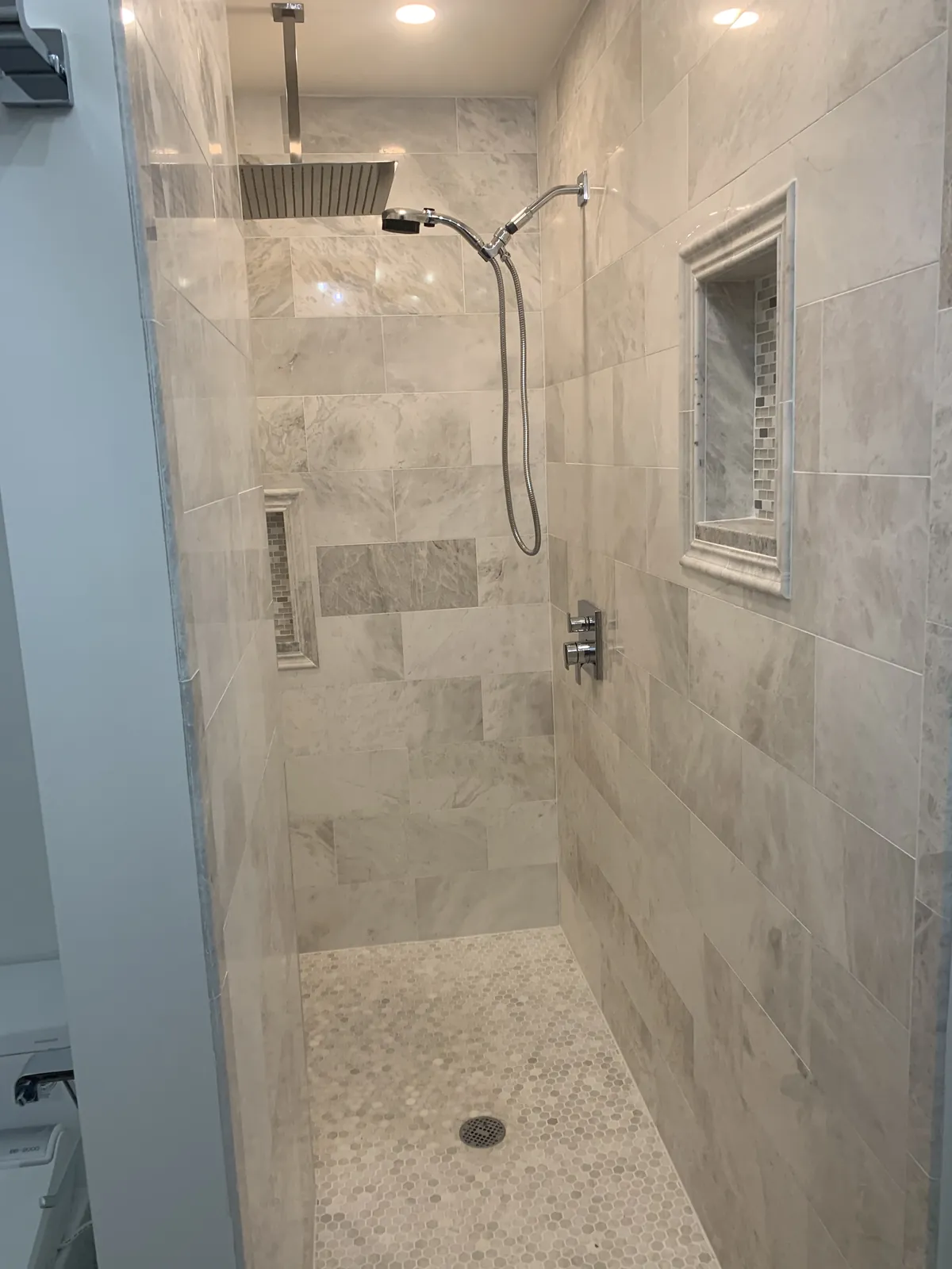Marble walk-in shower with rain head