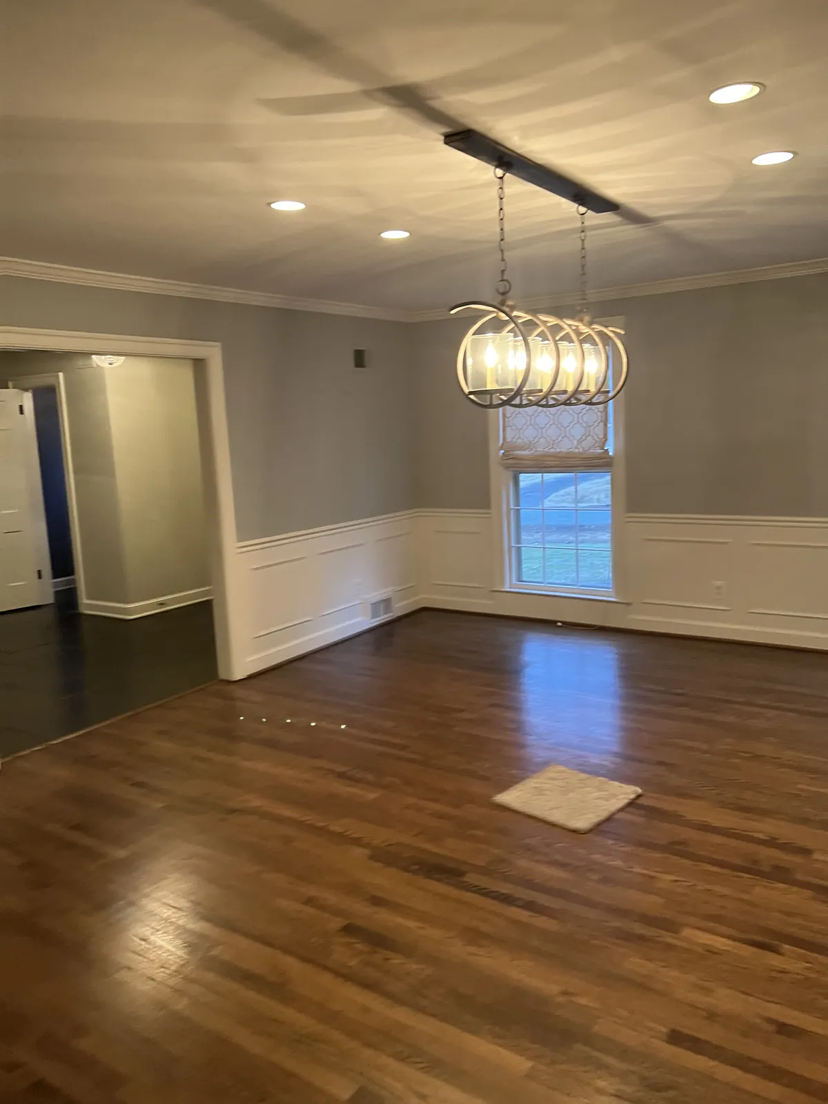 Dining room with wainscoting and hardwood floors