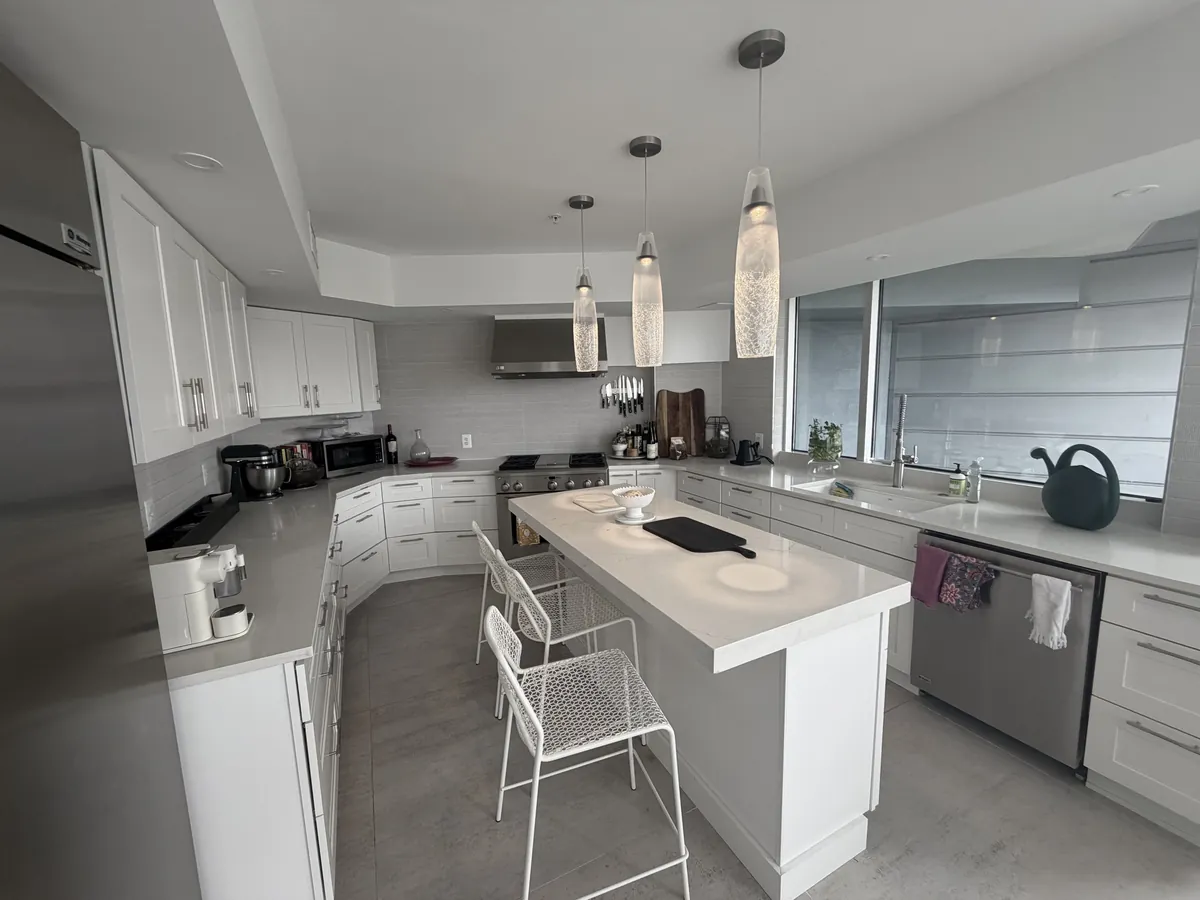 White shaker kitchen with quartz island